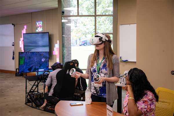 A Motlow employee uses a VR headset