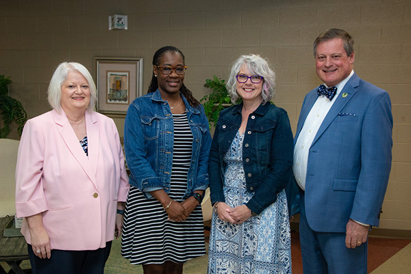 Pictured, left to right: Renee Austin, Executive Vice President for Business and Finance; Kimberly Snipes; Nickie Fanning; and Mark Hutchins, Assistant Vice President for Corporate and Foundation Services.